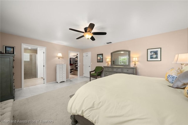 1904 Mulligan Rd, Sebring, FL 33872 - bedroom featuring a walk in closet, ceiling fan, baseboards, ensuite bath, and a closet
