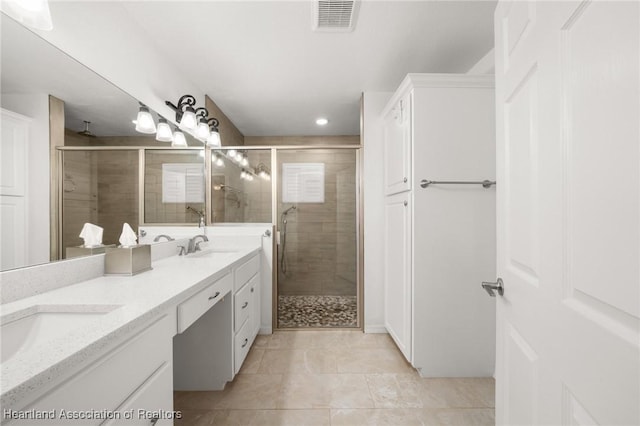 1904 Mulligan Rd, Sebring, FL 33872 - bathroom featuring a stall shower, tile patterned flooring, double vanity, and recessed lighting