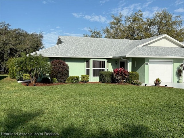 ranch-style home with a front lawn, an attached garage, and stucco siding