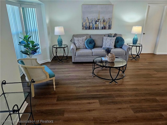 living room with baseboards and wood finished floors