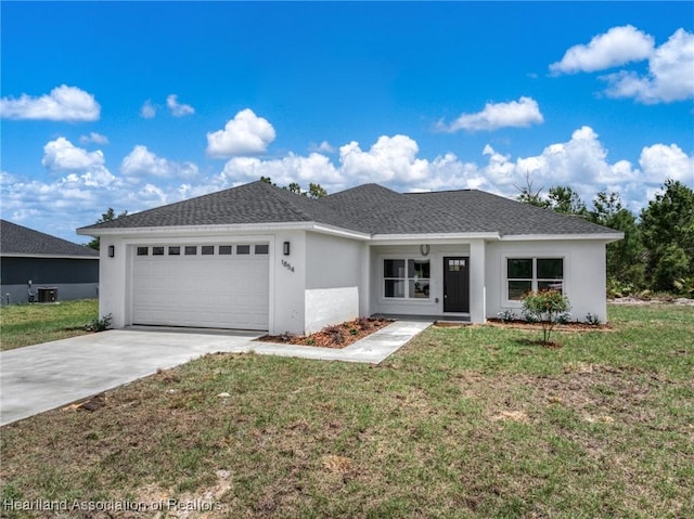 1854 Hartman Rd, Avon Park, FL 33825 - ranch-style home featuring roof with shingles, an attached garage, concrete driveway, stucco siding, and a front lawn