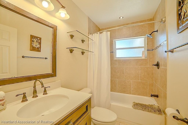 bathroom with toilet, vanity, and shower / bathtub combination with curtain