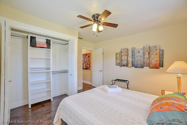 bedroom with visible vents, a closet, baseboards, ceiling fan, and dark wood-style flooring