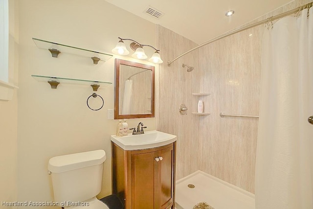 bathroom featuring visible vents, a shower with curtain, vanity, and toilet