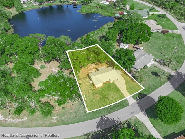 birds eye view of property with a water view