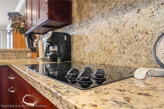 kitchen featuring decorative backsplash and black electric cooktop