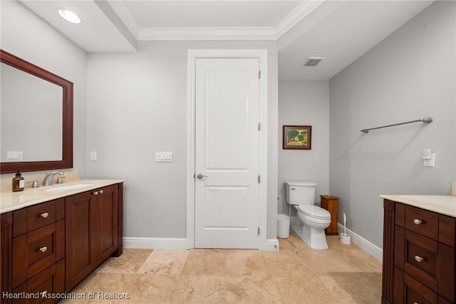 bathroom with toilet, crown molding, and vanity