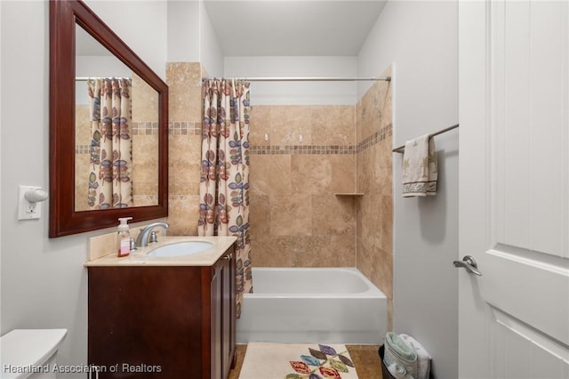 full bathroom featuring toilet, vanity, and shower / bath combo with shower curtain