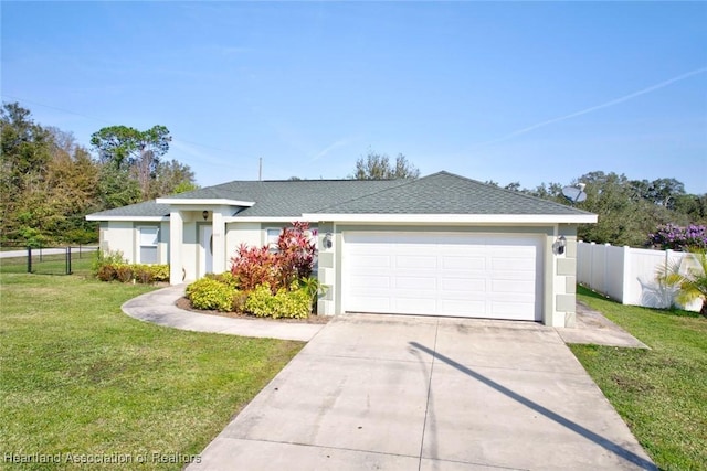 single story home with a garage and a front lawn