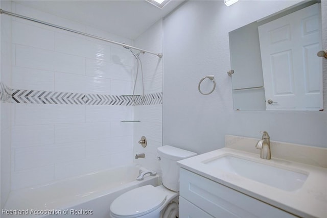 full bathroom with vanity, toilet, and tiled shower / bath