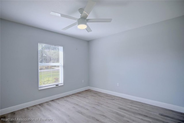 spare room with ceiling fan and light hardwood / wood-style floors