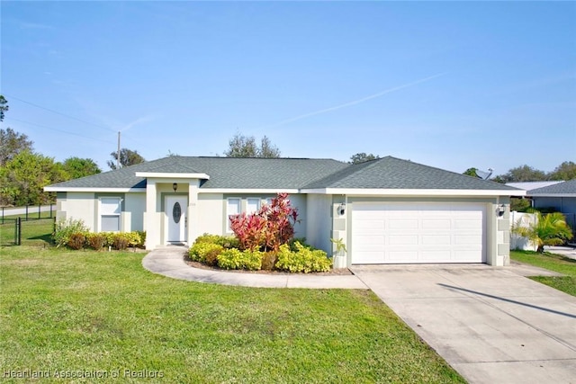 ranch-style house featuring a garage and a front lawn