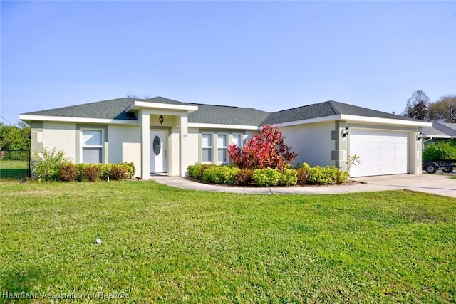 ranch-style home featuring a garage and a front lawn