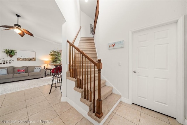 3038 Cedora Ter, Sebring, FL 33870 - stairway with a ceiling fan, vaulted ceiling, and tile patterned flooring