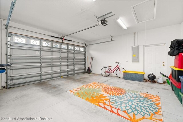 3038 Cedora Ter, Sebring, FL 33870 - garage with electric panel and a garage door opener