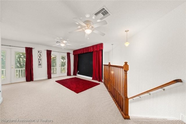 3038 Cedora Ter, Sebring, FL 33870 - unfurnished living room featuring french doors, carpet floors, and ceiling fan