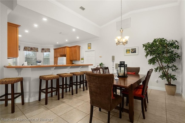 3038 Cedora Ter, Sebring, FL 33870 - dining area with ornamental molding, light tile patterned floors, a chandelier, vaulted ceiling, and recessed lighting