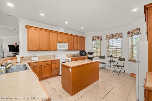 3038 Cedora Ter, Sebring, FL 33870 - kitchen featuring white appliances, crown molding, light countertops, a kitchen island, and light tile patterned floors