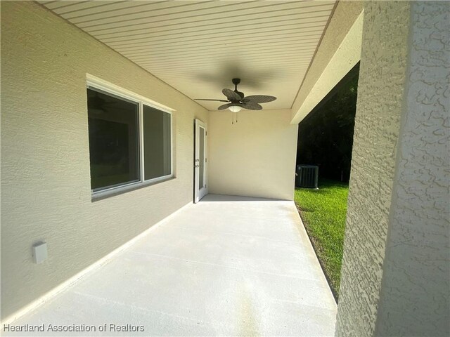 view of patio / terrace with ceiling fan and cooling unit