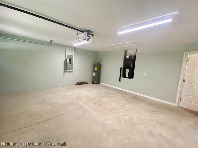 garage featuring electric water heater and electric panel