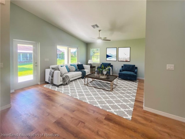 living room featuring visible vents, ceiling fan, wood finished floors, high vaulted ceiling, and baseboards