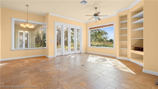 interior space featuring ceiling fan with notable chandelier and visible vents