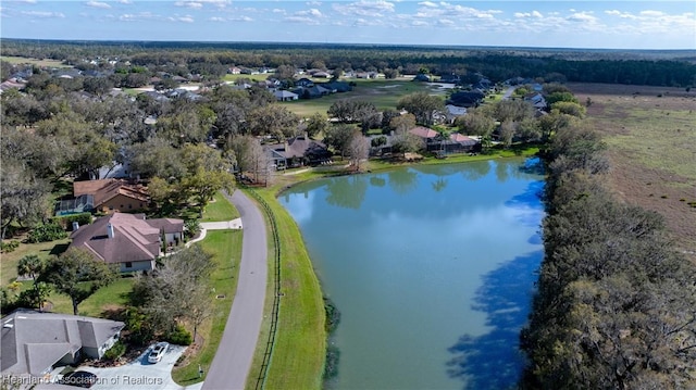 birds eye view of property with a residential view and a water view