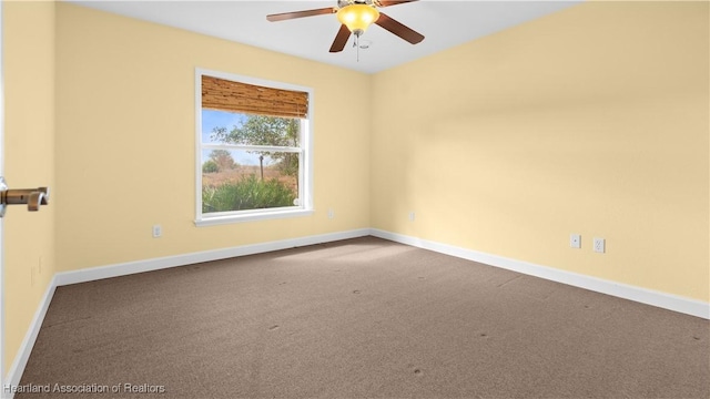 empty room featuring carpet floors, ceiling fan, and baseboards