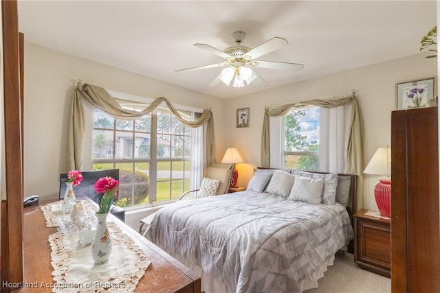 carpeted bedroom featuring ceiling fan