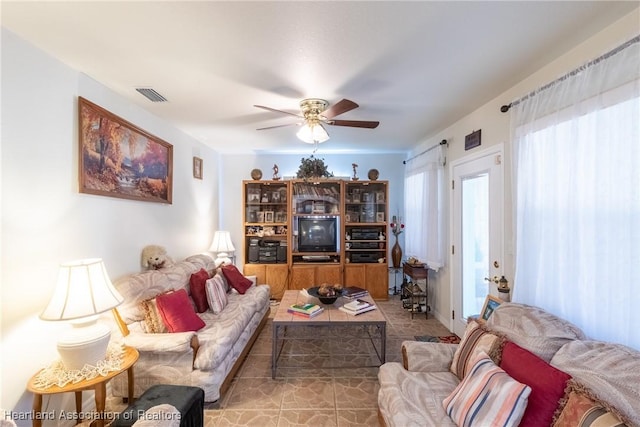 living room featuring ceiling fan