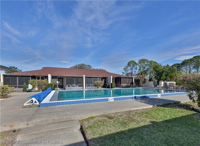 view of pool featuring a yard