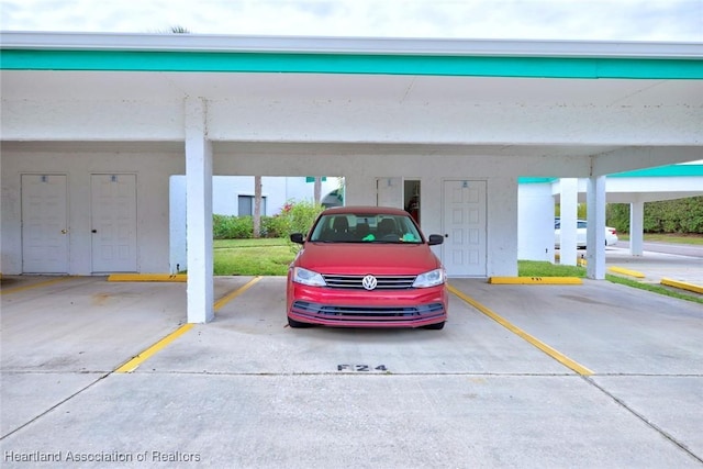 garage featuring a carport