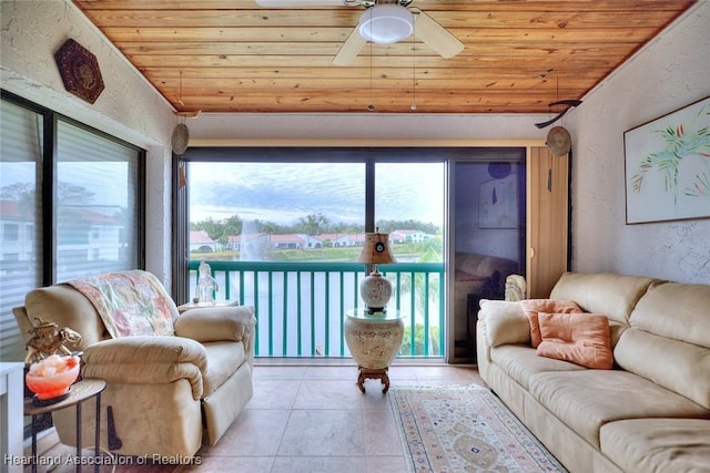 living room featuring ceiling fan, light tile patterned floors, lofted ceiling, and wood ceiling