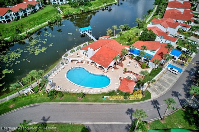 birds eye view of property with a water view