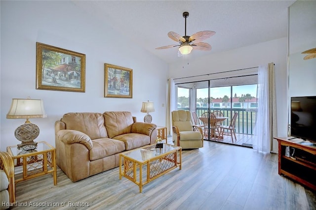 4915 Casablanca Cir Unit H22, Sebring, FL 33870 - living room featuring ceiling fan, wood finished floors, and lofted ceiling