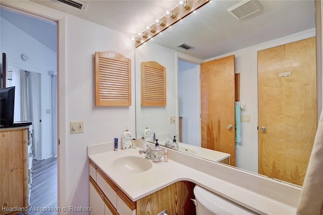 4915 Casablanca Cir Unit H22, Sebring, FL 33870 - bathroom featuring vanity and wood finished floors