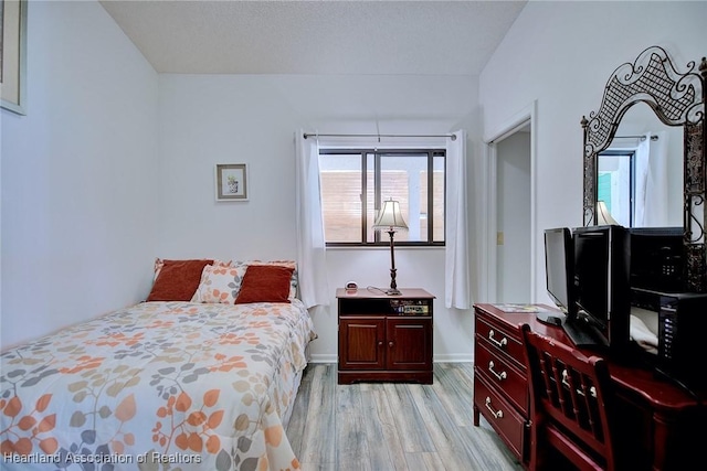 4915 Casablanca Cir Unit H22, Sebring, FL 33870 - bedroom with light wood finished floors and baseboards