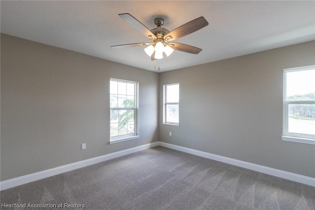 empty room with carpet flooring and ceiling fan