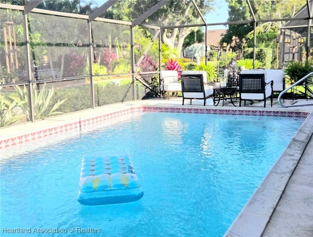2919 Summertree Dr, Sebring, FL 33872 - pool featuring glass enclosure and a patio