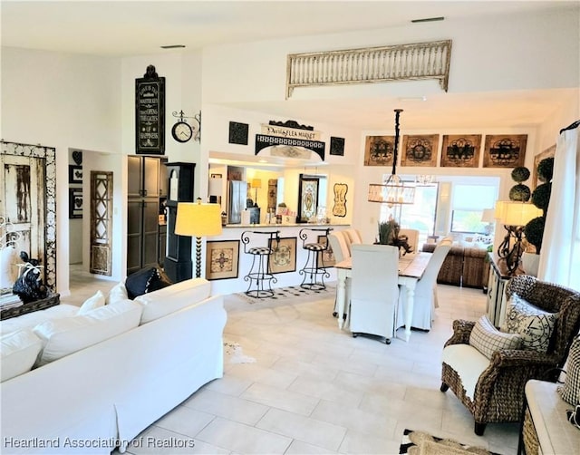 2919 Summertree Dr, Sebring, FL 33872 - living area with a high ceiling and a chandelier
