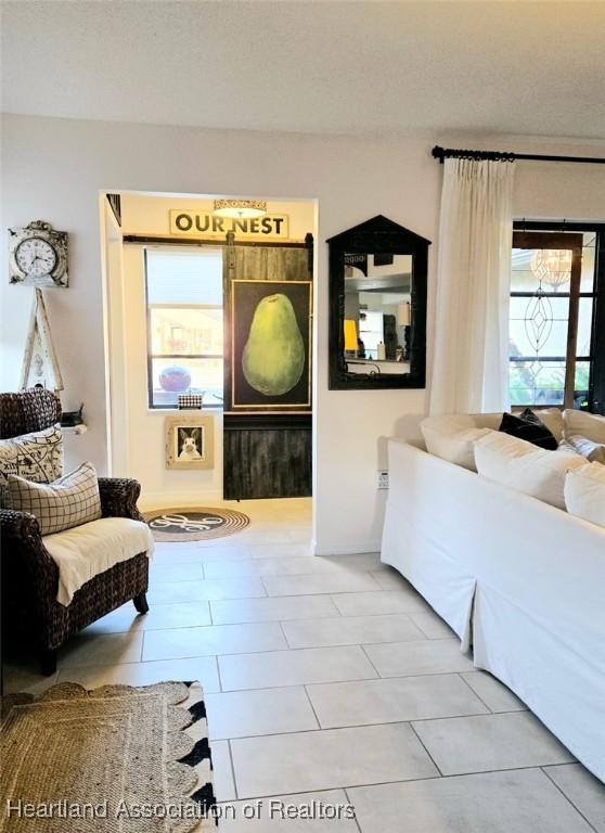 2919 Summertree Dr, Sebring, FL 33872 - living area featuring tile patterned flooring