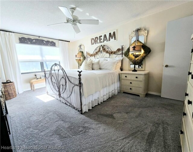 2919 Summertree Dr, Sebring, FL 33872 - bedroom with dark carpet, a textured ceiling, and ceiling fan