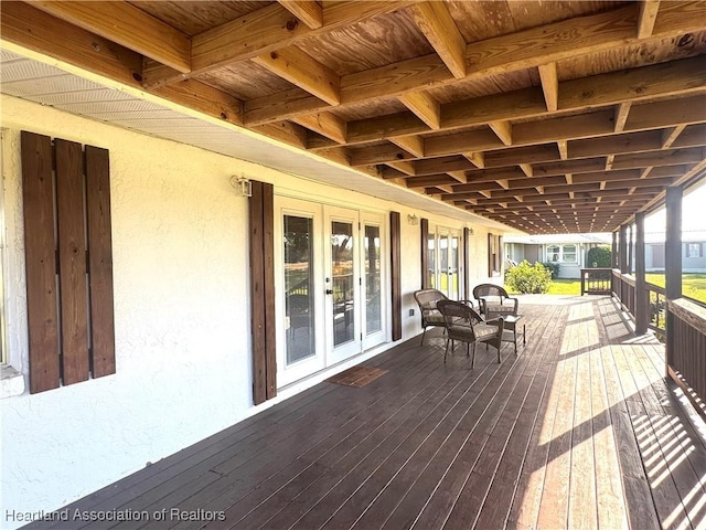 wooden deck featuring french doors