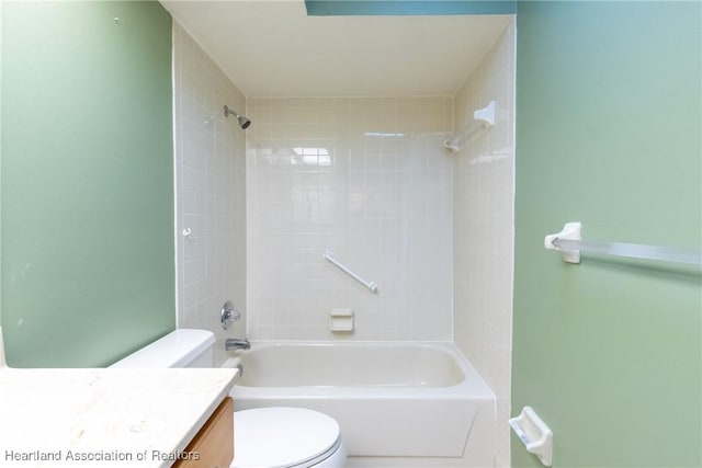 full bathroom with vanity, toilet, and tiled shower / bath