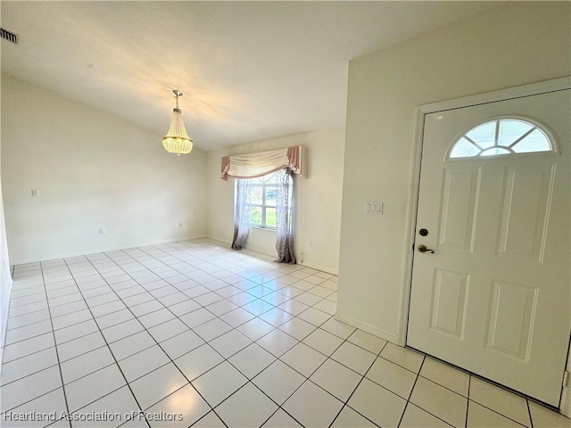 entrance foyer with light tile patterned floors, baseboards, and visible vents