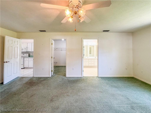 120 Honeycomb Ave, Lake Placid, FL 33852 - unfurnished bedroom featuring a walk in closet, carpet, and visible vents