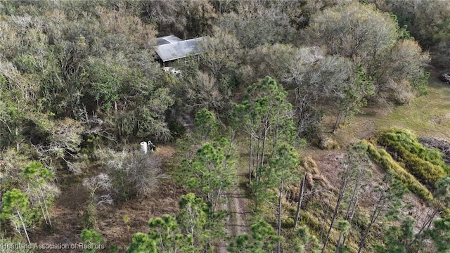 drone / aerial view with a view of trees