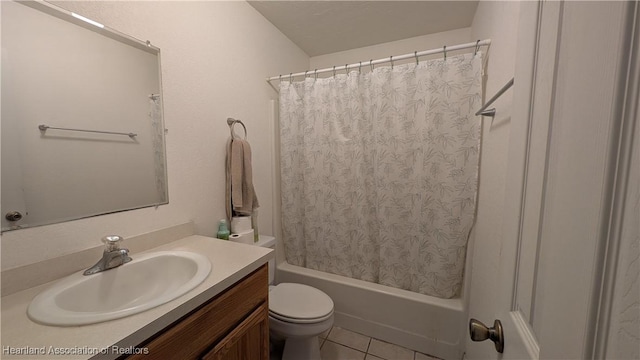 full bath with tile patterned flooring, shower / tub combo with curtain, vanity, and toilet