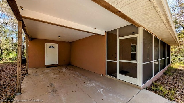 view of patio / terrace with a sunroom