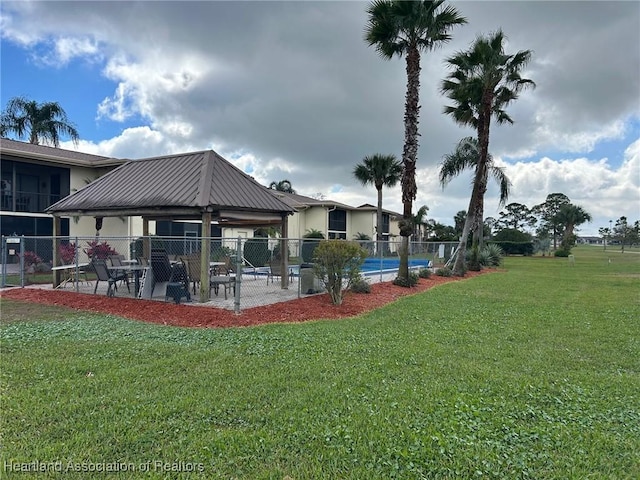 view of yard with a patio area, fence, and a gazebo